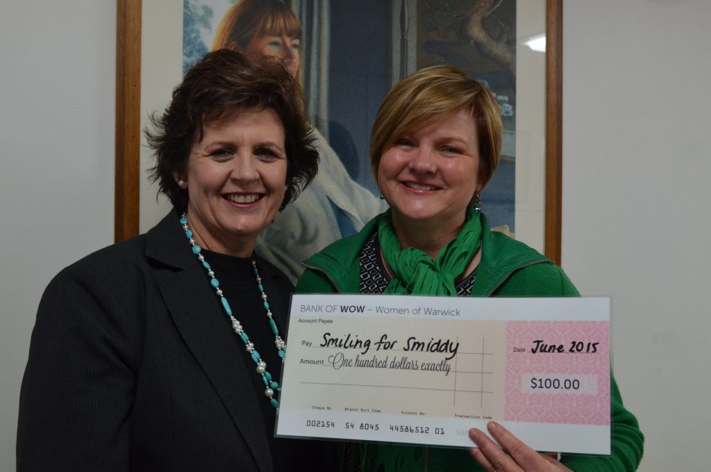 WOWED BY DONATION: Sue Hamlet from the Women of Warwick presented a cheque to Tracy Vellacott for the Smiling for Smiddy foundation. 